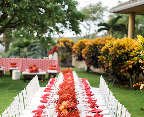 Colin Cowie Rehearsal Dinner Table Setting with Red Coral