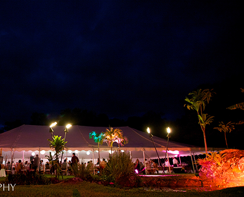 Wedding Reception Tent with Dramatic Evening Lighting